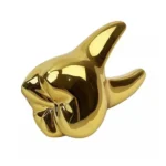 Dente dorato decorativo